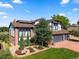 Beautiful two-story home showcasing well-manicured landscaping, a three-car garage, and a brick facade at 1175 Oakhurst Dr, Broomfield, CO 80020