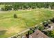 Scenic aerial view of golf course, and home's proximity to recreational greens at 1175 Oakhurst Dr, Broomfield, CO 80020