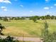 Scenic view of the lush golf course as seen from the property at 1175 Oakhurst Dr, Broomfield, CO 80020