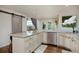 Bright kitchen with granite countertops, stainless appliances, and a seamless connection to the dining area at 1175 Oakhurst Dr, Broomfield, CO 80020