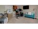 Inviting living room features a desk, a music setup, and comfortable seating perfect for work or relaxation at 1175 Oakhurst Dr, Broomfield, CO 80020