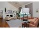 Cozy living room with a fireplace, vaulted ceilings, and comfortable seating at 1175 Oakhurst Dr, Broomfield, CO 80020