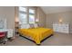 Light-filled bedroom featuring a bed, storage and neutral decor at 1175 Oakhurst Dr, Broomfield, CO 80020