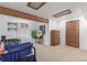 Finished basement bedroom with wooden ceiling beams and recessed lighting; includes wooden dresser at 14093 E Radcliff Cir, Aurora, CO 80015