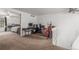 Spacious bonus room with a desk, guitars and great natural light at 14093 E Radcliff Cir, Aurora, CO 80015