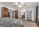 Main bedroom with ceiling fan and doorway to the en-suite bathroom at 14093 E Radcliff Cir, Aurora, CO 80015
