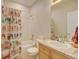 This bathroom features a shower-tub combo and tile countertops at 17613 E Peakview Ave, Aurora, CO 80016
