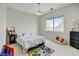 Cheerful bedroom with a playful rug, bright window, and cozy décor at 17613 E Peakview Ave, Aurora, CO 80016