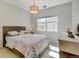 This bedroom has a window, a dresser, and a beautifully patterned bed at 17613 E Peakview Ave, Aurora, CO 80016