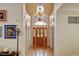 Grand foyer with a chandelier and a decorative front door with sidelights at 17613 E Peakview Ave, Aurora, CO 80016