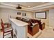 This home theater features comfortable seating and a large screen for entertainment at 17613 E Peakview Ave, Aurora, CO 80016