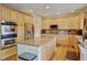 Spacious kitchen island with granite countertop and stainless steel appliances at 17613 E Peakview Ave, Aurora, CO 80016