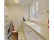 This laundry room features modern appliances, ample countertop space, and a window at 17613 E Peakview Ave, Aurora, CO 80016
