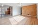 Open concept living room with a view into the kitchen and hardwood floors at 13095 W 23Rd Ave, Golden, CO 80401