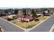 Aerial view of a home featuring a well-manicured lawn and mature trees at 2799 S Ingalls Way, Denver, CO 80227