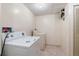 Practical laundry room with essential appliances, ample space, and convenient access for all your washing needs at 2799 S Ingalls Way, Denver, CO 80227