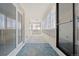 Enclosed porch featuring ample natural light and a carpeted floor, ideal for year-round enjoyment at 2799 S Ingalls Way, Denver, CO 80227