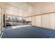 Inviting sunroom with wall-to-wall windows, blinds, and cozy blue carpeting providing a relaxing space at 2799 S Ingalls Way, Denver, CO 80227