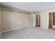 This bedroom has light grey carpet, neutral walls, closet, and a door to the bathroom at 4400 S Quebec St # 108L, Denver, CO 80237