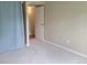Cozy bedroom featuring neutral paint, carpet, and closet with a white door at 4400 S Quebec St # 108L, Denver, CO 80237