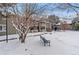 Exterior view of community grounds featuring building exteriors and snow covered grounds at 4400 S Quebec St # 108L, Denver, CO 80237
