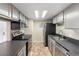 Efficient kitchen featuring modern appliances, gray cabinets, and sleek countertops for a contemporary look at 4400 S Quebec St # 108L, Denver, CO 80237