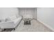 The finished basement has an open floor plan with cozy furniture and a stylish rug at 4953 W 61St Ave, Arvada, CO 80003