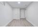 Bright bedroom with white walls, light wood floors, and two closets at 4953 W 61St Ave, Arvada, CO 80003