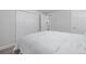 The airy bedroom has an closet and an entryway to the bathroom at 4953 W 61St Ave, Arvada, CO 80003