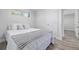 Calm bedroom featuring a comfortable bed, large window, and an entry way to a connected room at 4953 W 61St Ave, Arvada, CO 80003