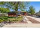 Charming red brick home with a well-maintained front yard and a mature shade tree at 4953 W 61St Ave, Arvada, CO 80003