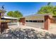 Detached garage with a white door and driveway in a backyard setting at 4953 W 61St Ave, Arvada, CO 80003