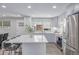 Well-lit kitchen with stainless steel appliances, a large island, and view to the backyard at 4953 W 61St Ave, Arvada, CO 80003