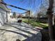 Large backyard featuring a concrete patio, lush lawn, trampoline, and mature trees, ideal for outdoor enjoyment at 4416 E 93Rd Pl, Thornton, CO 80229