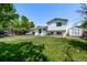 Spacious backyard featuring a well-maintained lawn, storage shed, and home exterior, perfect for outdoor activities at 4416 E 93Rd Pl, Thornton, CO 80229