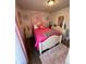 Cozy bedroom featuring a pink color scheme, plush rug and inviting natural light at 4416 E 93Rd Pl, Thornton, CO 80229