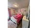 Comfortable bedroom featuring a cozy bed, a vanity dresser, and soft carpeting at 4416 E 93Rd Pl, Thornton, CO 80229