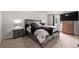 Inviting bedroom with a king-size bed, soft lighting, and stylish decor at 4416 E 93Rd Pl, Thornton, CO 80229