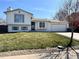 Charming two-story home featuring a well-maintained lawn and attached two car garage at 4416 E 93Rd Pl, Thornton, CO 80229