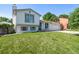 Traditional two-story home featuring a manicured lawn and attached two car garage at 4416 E 93Rd Pl, Thornton, CO 80229