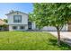 Charming two-story home with a lush green lawn and a well-maintained exterior at 4416 E 93Rd Pl, Thornton, CO 80229