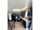 Bright kitchen featuring blue cabinets, white countertops and modern appliances; perfect for cooking and entertaining at 4416 E 93Rd Pl, Thornton, CO 80229