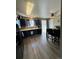 Updated kitchen featuring dark cabinets, modern appliances, a garden window and a sliding door to the backyard at 4416 E 93Rd Pl, Thornton, CO 80229