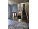 An open living area featuring stylish floors and an open staircase to the upper level at 4416 E 93Rd Pl, Thornton, CO 80229