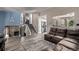 Cozy living room and stairs with natural light featuring an open floor plan at 4416 E 93Rd Pl, Thornton, CO 80229