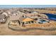 Aerial view of community clubhouse with patio seating and fire pit at 5474 Espana St, Denver, CO 80249