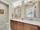 Bathroom featuring double sinks, ample counter space, modern lighting and hardware at 5474 Espana St, Denver, CO 80249