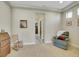 Bedroom view with a rocking chair and a recliner in a spacious carpeted area at 5474 Espana St, Denver, CO 80249