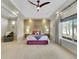 Bright bedroom with a large window, recessed lighting, and a decorative accent wall at 5474 Espana St, Denver, CO 80249