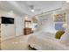 Bedroom featuring a ceiling fan, recessed lighting, and a comfortable white bed at 5474 Espana St, Denver, CO 80249
